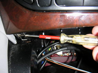 Opening the hooks under the instrument panel
